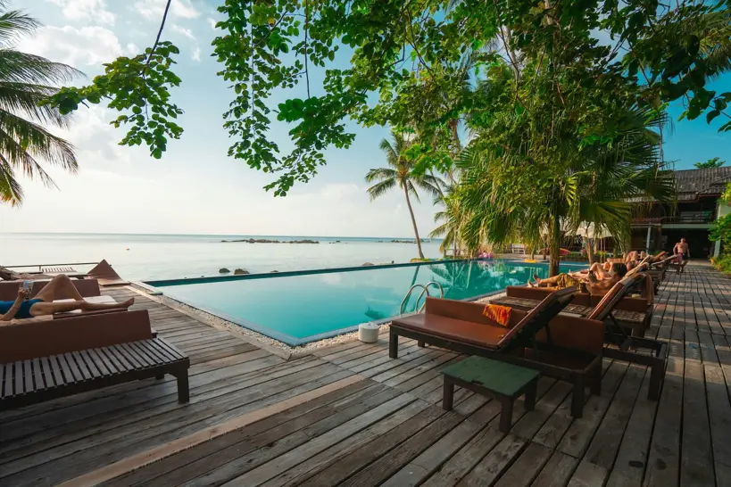 Hospitality property with guest rooms overlooking a pool